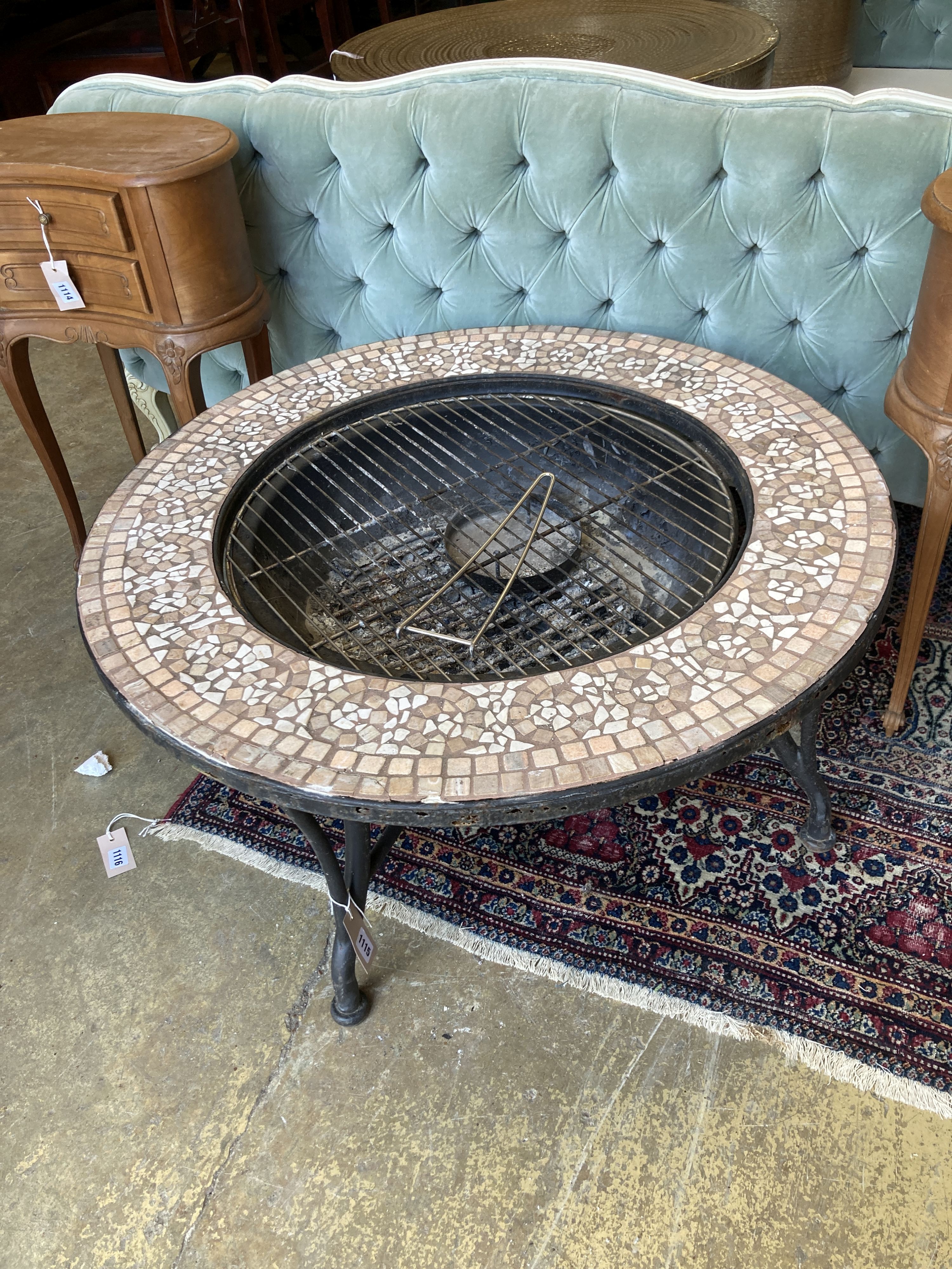 A mosaic top firepit